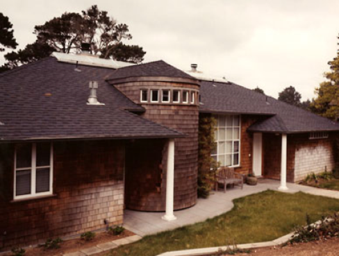 Santa Cruz has a very restrictive planning code which encourages traditional details on the street face of the houses. In this case the quiet shingle facade allows the spacious interior, dramatic curved window wall, and views beyond to be a surprise to the first time visitor.