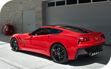 It's fun to show off your Chevy, but be sure to park it in a garage if you can. A 2019 Chevrolet Corvette Stingray outside of a garage.