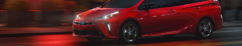 Shop lighting accessories at Capitol Toyota Photo of a red Toyota against a red background with the headlights and driving lights on.