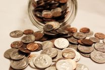 Coins Coins spill from jar. Photo illustration by Kathryn Price.