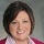 Karen_business_photo_blue_background_close_up