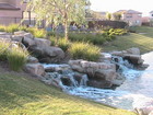 A Rock Waterfall adding to the tranqul ambiance at Willow Walk, a new Real Estate development in Hemet CA