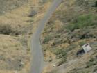 The road is directly below the side of this hilltop that forms Bautista Creek, East Hemet CA