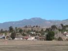 A look East from Fairview Ave in East Hemet at Spraig heights with snow covered peak of Mt. San Jacinto in the background