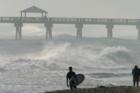 Surfing at Juno Beach - near the Juno Beach Pier