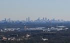 The Atlanta skyline as seen from near the summit of Kennesaw Mountain. This is one of, if not the most photographed vistas in the city. As the crow flies it is about 12 miles to downtown from the center of Marietta.