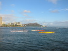 Canoe race with Daimond Head in background.