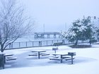 Waterfront park and boat dock snowfall