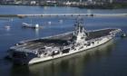 The USS Ronald Reagan. There crew showing respect to the Arizona Memroial as they pass.