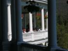 This is a view from the back veranda over to the wider part of the back veranda. I liked this shot of the lady watching me take this photo.