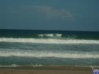 One wave with several takers making an effort to get the wave.