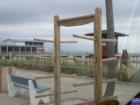 Surf rack near showers keeps boards in place and ding free while cleansing off some salt water.