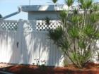 Palm Isles, white fence during a warm day in january, Fl