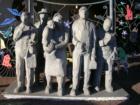 Seattle's Fremont "Urban Village" and the interactive sculpture "Wating For The Interurban" in it's temporay location in front of the History House.