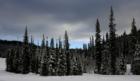The slopes face south and are sunny most days, but dark clouds in this photograph bring the promise of fresh powder in the morning.  Photograph by Richard Anderson.