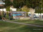 Frank T. Crowe memorial park. At night the wall fresco is lit.