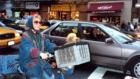 NY, NY: Lady riding a bike with her dog