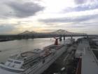 The Mississippi flows through the New Orleans Warehouse District by the River Walk which is a shoping center along the river. Cruise Ships stop for pick-ups on a weekly basis.