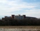 A view of Frisco's new state-of-the-art Police Headquarters from undeveloped land in Chapel Creek, a custom home community in Frisco TX.