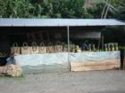 Fresh fruit and woven goods sold across from Velzy