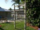 Donated surfboard racks nears the showers across the street from the pier at Juno Beach. A dedication to a lost surfer, Andy Dicembrino.