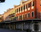 French Quarter Street in the early morning hours at sunrise. Many people live in the Quarter. Many of the units are condos that are second homes and vacation get a ways.