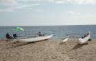 Makaha - Outrigger canoes on the sand.  The humpback whales just offshore.