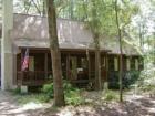 Variety in housing including rustic type cabin in a private established development.
