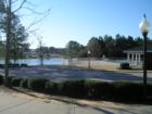 View of the pool, pond, and playground at Prestonwood Village.