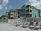 View of the pool and condos from the beach at Sunset Harbor in Cedar Lake, Indiana