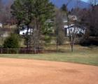 OAKLEY Neighborhood. Asheville, N.C. Here homes gather at the edge of the recreation park .Track and Field.