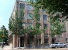 The Lofts at 402 Julia is a condo conversion with smaller units. There are 24 units in the complex across the street from Emeril's. A great place to begin. The first floor is an art gallery.