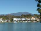 View of Saddleback Mountain behind homes around the largest lake in Lake Forest
