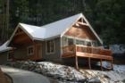 This mountain cabin is located in the Ponderosa neighborhood. This home features a heated driveway and one level living. It is close to Lake Wenatchee and Stevens Pass.
