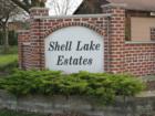 Shell Lake Estates - Naperville, IL.  DuPage County, Wheatland Township, School District 204.  This unique community has its own private lake, that guests must have passes to use.