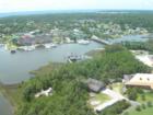 Aerial view of downtown Manteo water front with the Elizabeth II docked at Iceplant Island