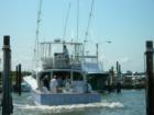 Offshore charter boat returns from fishing trip at Oregon Inlet Marina
