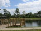 Relax by pond in chairs in  Deed restricted community with it's own pool, tennis courts club house. 
