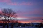 Sunset on a snowy night with views of Longs Peak
