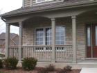 A nice touch...a front porch. Seems like more homes now have a front porch. Provides extra protection from the weather as well. School District #204.