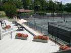 The Chapel Hill Country Club Tennis Complex consists of 10 lighted Har-Tru (soft surface) courts, 4 hard courts with a practice backboard, a large observation terrace and covered pavilion. 
      
      