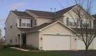 Exterior picture of Condo at The Enclave of Country Lakes. This end unit has a 2 car garage, 2 bedrooms, 2 bathrooms and a fireplace. Price range between $200,000 and $250,000. School District #204.