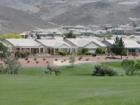 Homes at Sun City MacDonald Ranch in Henderson, NV have views of Desert Willow Golf Course and the Black Mountain foothills.
