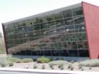 A wall of windows at the Paseo Verde Library in Henderson, NV reflects the desert landscape and gives library visitors a spectacular view of the Las Vegas valley.
