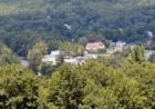 A view of Hawley, from the Queen of Peace Cemetery, surrounded by the Pocono Mountains.  On the left you can see the Lackawaxen River.  The predominant building is The Settler's Inn Bed & Breakfast.