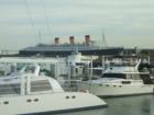 View of Queen Mary from walkway between Aquarium of the Pacific and Resturants
