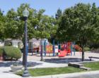 A playground and covered picnic area are part of the community park at Pebble Creek in Henderson, NV.