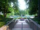 Savoy Park's beautiful plaza leading to outdoor swimming pool.