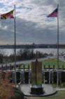 Maryland and U.S. flags frame a distant view of the USNA from the Rt. 2 Overlook.