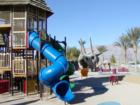 Mountain views, a variety of slides, and a giant dinosaur head are part of the atmosphere at Nature Discovery Park in North Las Vegas, NV.